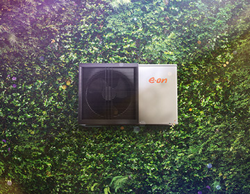 Heat pump laying on grass background