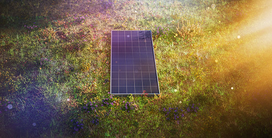 Solar panel laying on grass