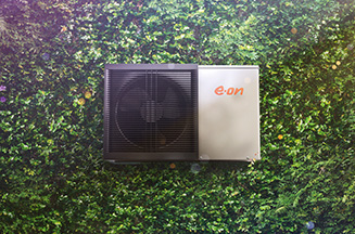 Heat pump laying on grass background